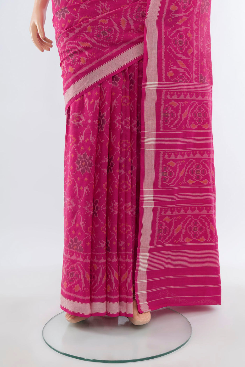 Pleats and pallu of Rani Pink Rajkot Patola Silk Saree with Ikat design on the body and Zari Border. 