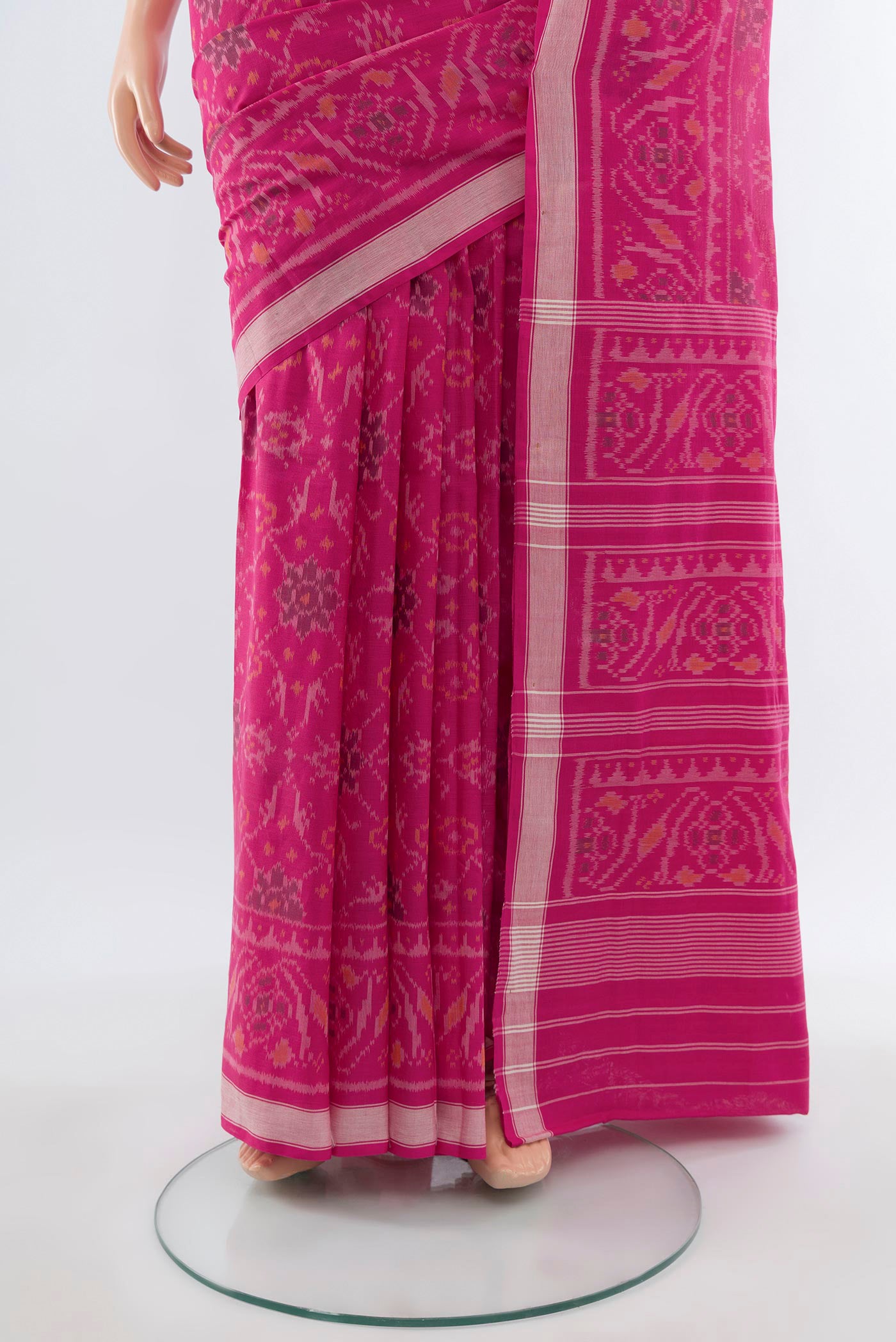 Pleats and pallu of Rani Pink Rajkot Patola Silk Saree with Ikat design on the body and Zari Border. 