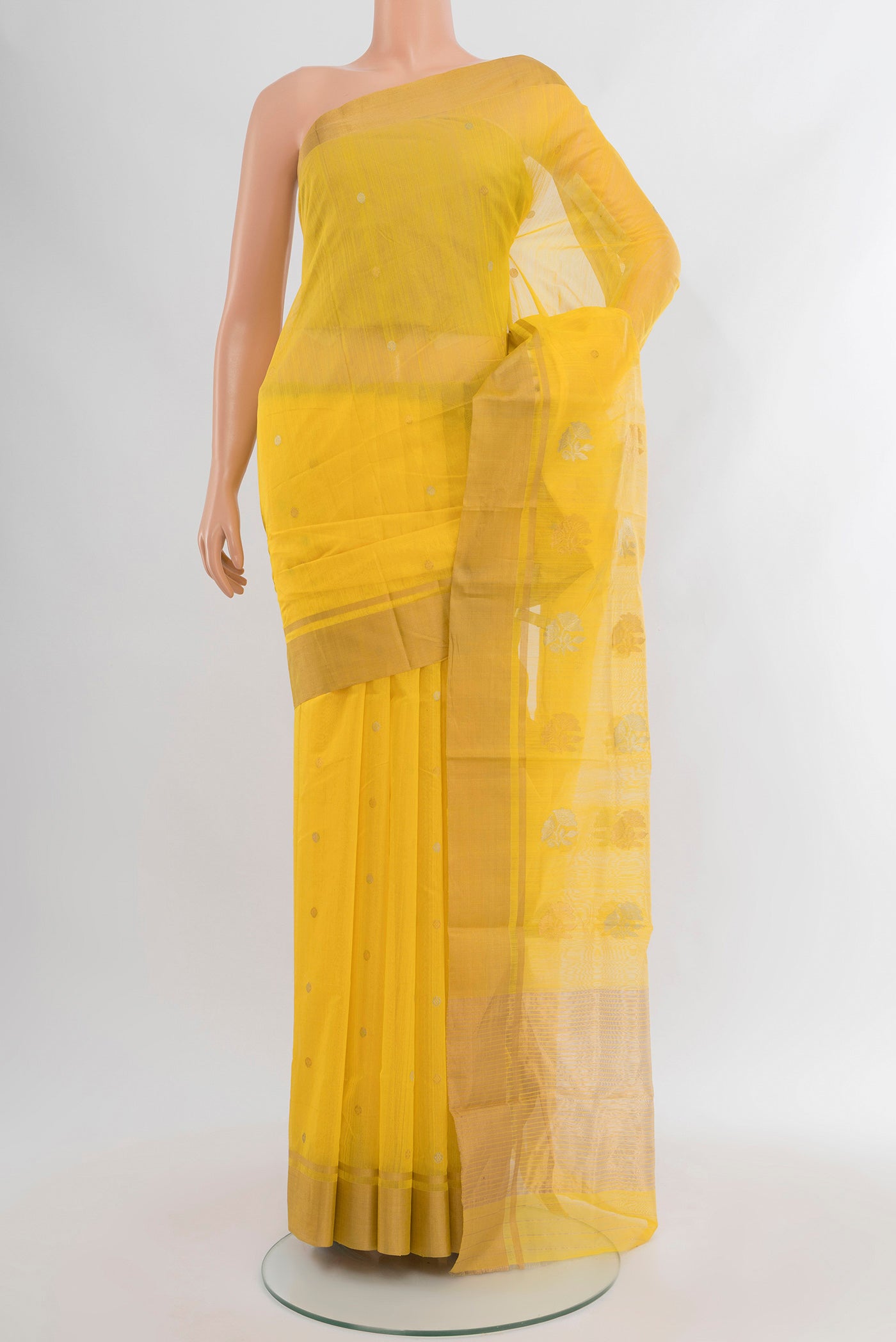 Yellow Chanderi Silk Cotton Saree with Zari Butta on the body and Zari Border.  displayed on a mannequin