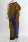Mehandi Green Soft Silk Saree with Zari Butta on the body and Silk Border.  displayed on a mannequin