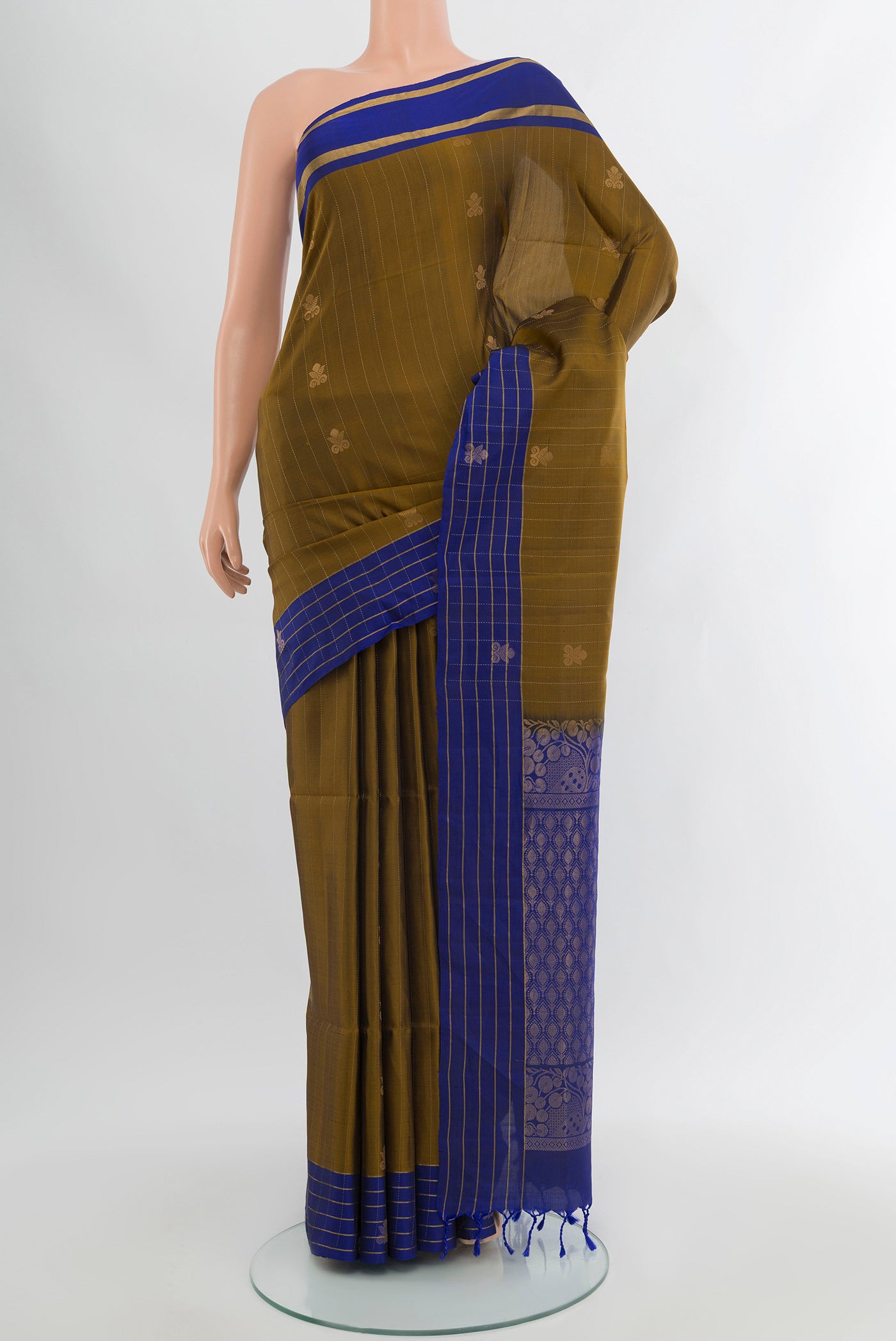 Mehandi Green Soft Silk Saree with Zari Butta on the body and Silk Border.  displayed on a mannequin