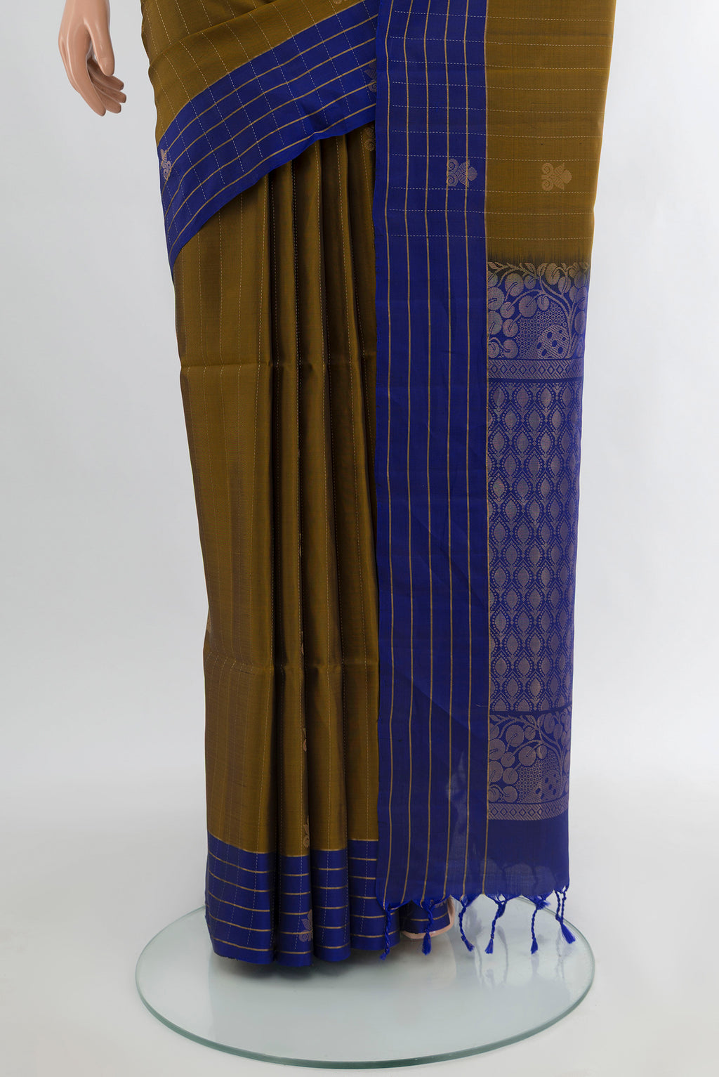 Pleats and pallu of Mehandi Green Soft Silk Saree with Zari Butta on the body and Silk Border. 