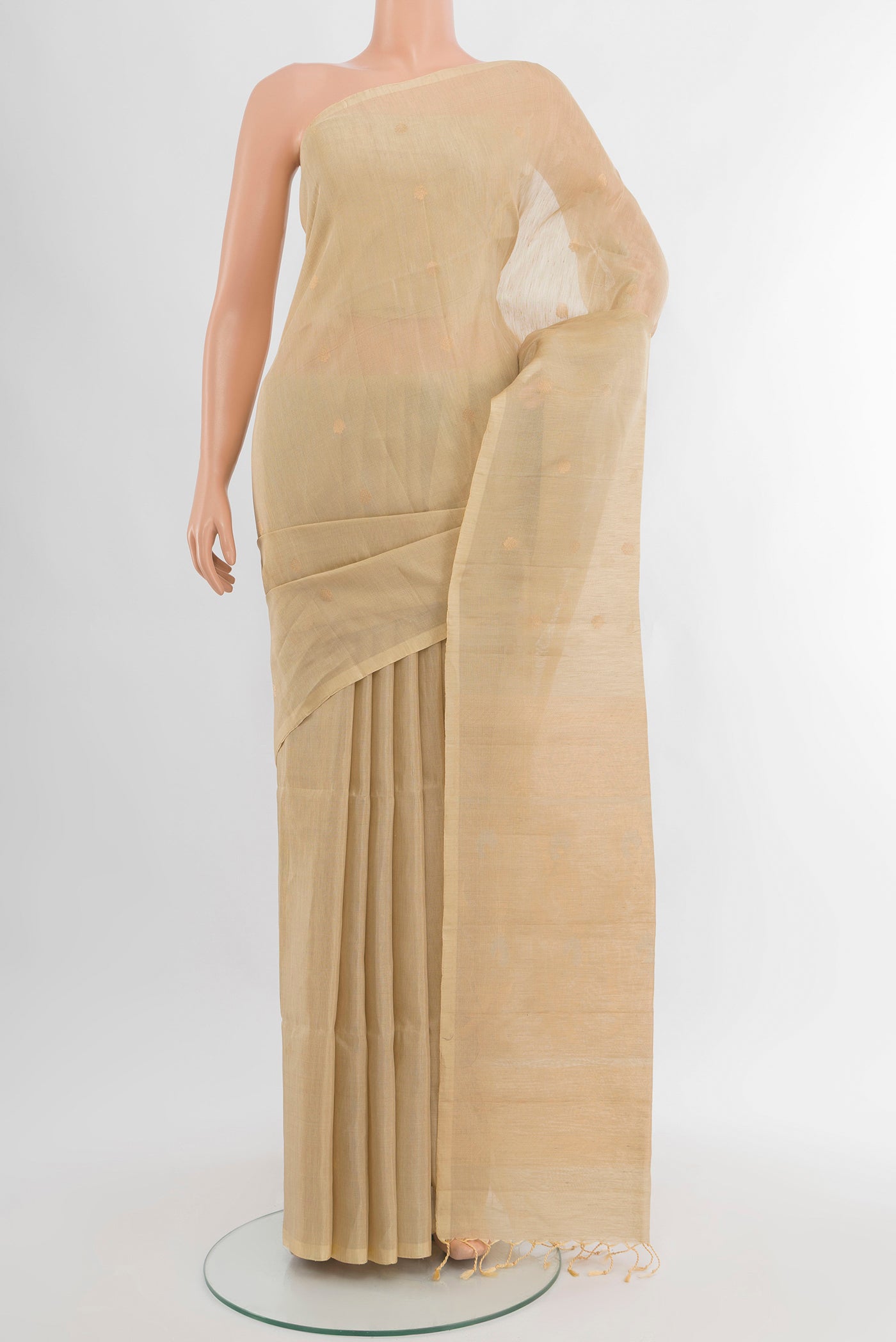 Cream Soft Silk Saree with Zari Butta on the body and Silk Border.  displayed on a mannequin