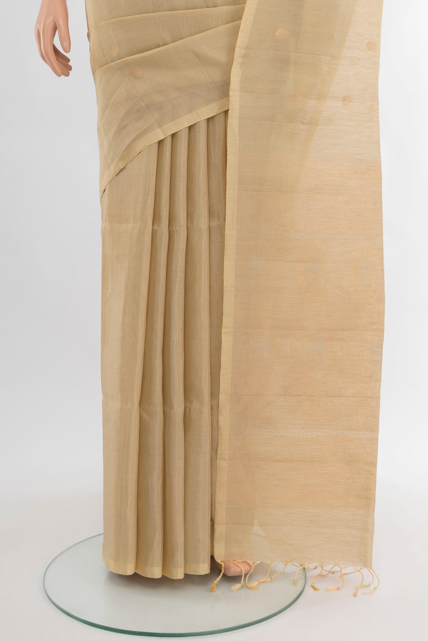 Pleats and pallu of Cream Soft Silk Saree with Zari Butta on the body and Silk Border. 