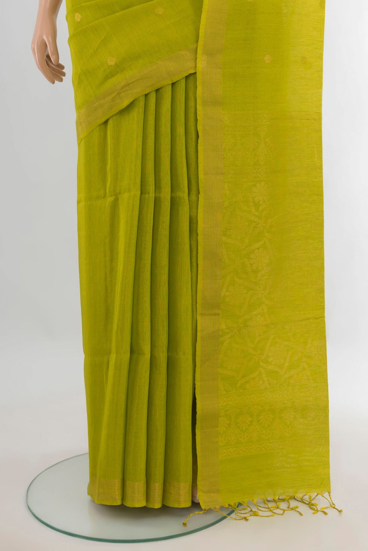 Pleats and pallu of Pure Silk Parrot Green Soft Saree with Zari Butta on the body and Zari Border. 