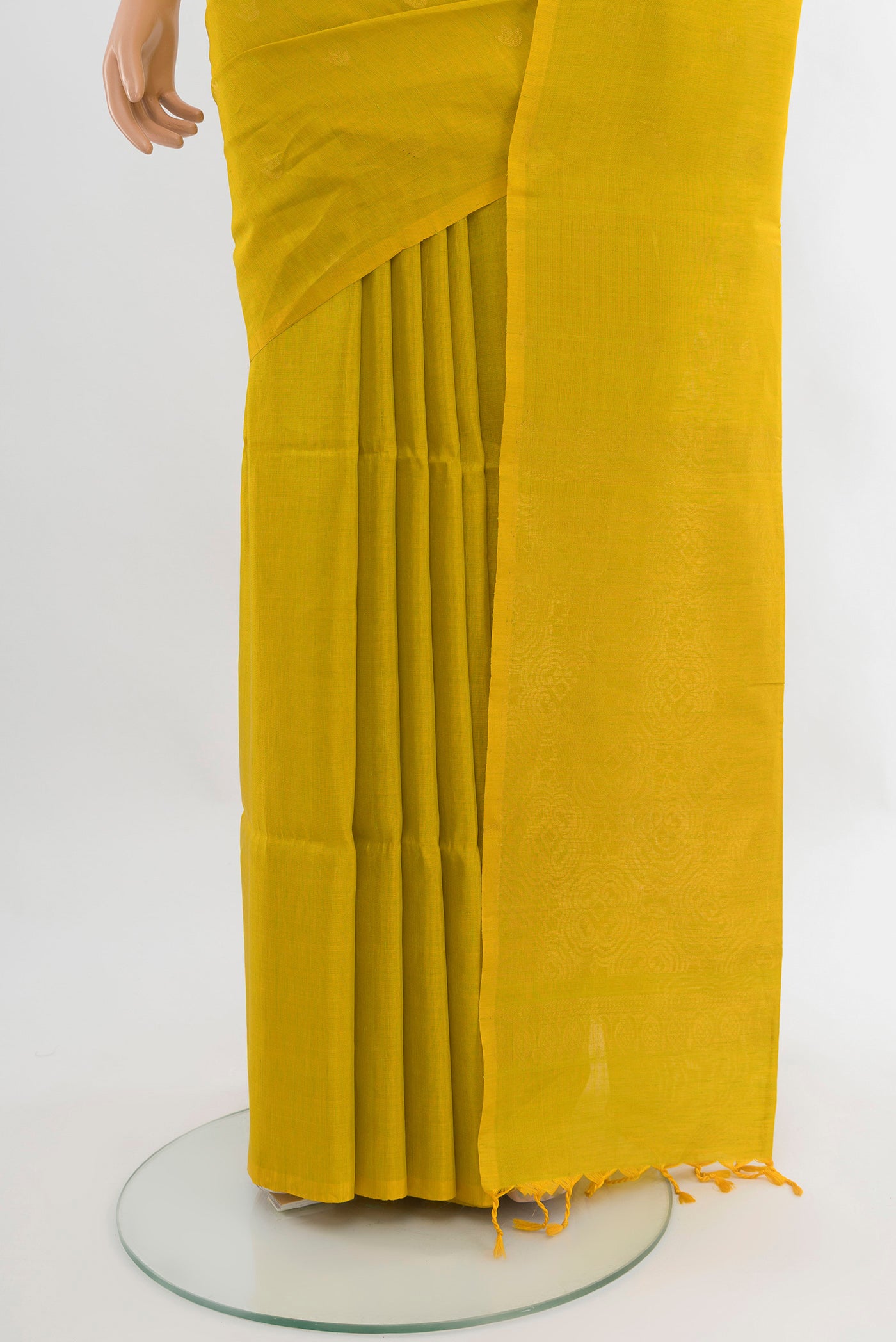 Pleats and pallu of Light Green Soft Silk Saree with Zari Butta on the body and Without Border. 