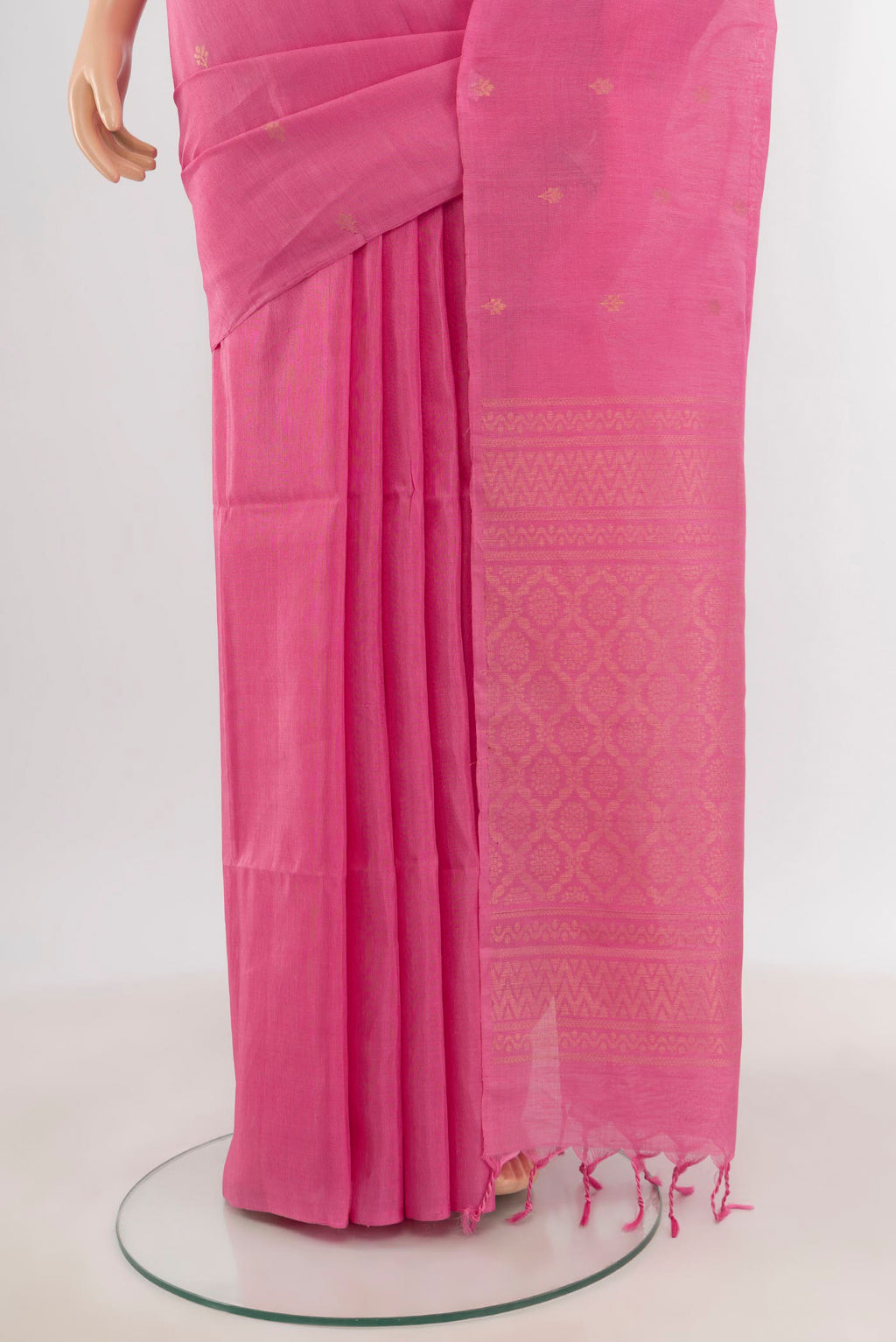 Pleats and pallu of Rose pink Soft Silk Saree with Zari Butta on the body and Without Border. 