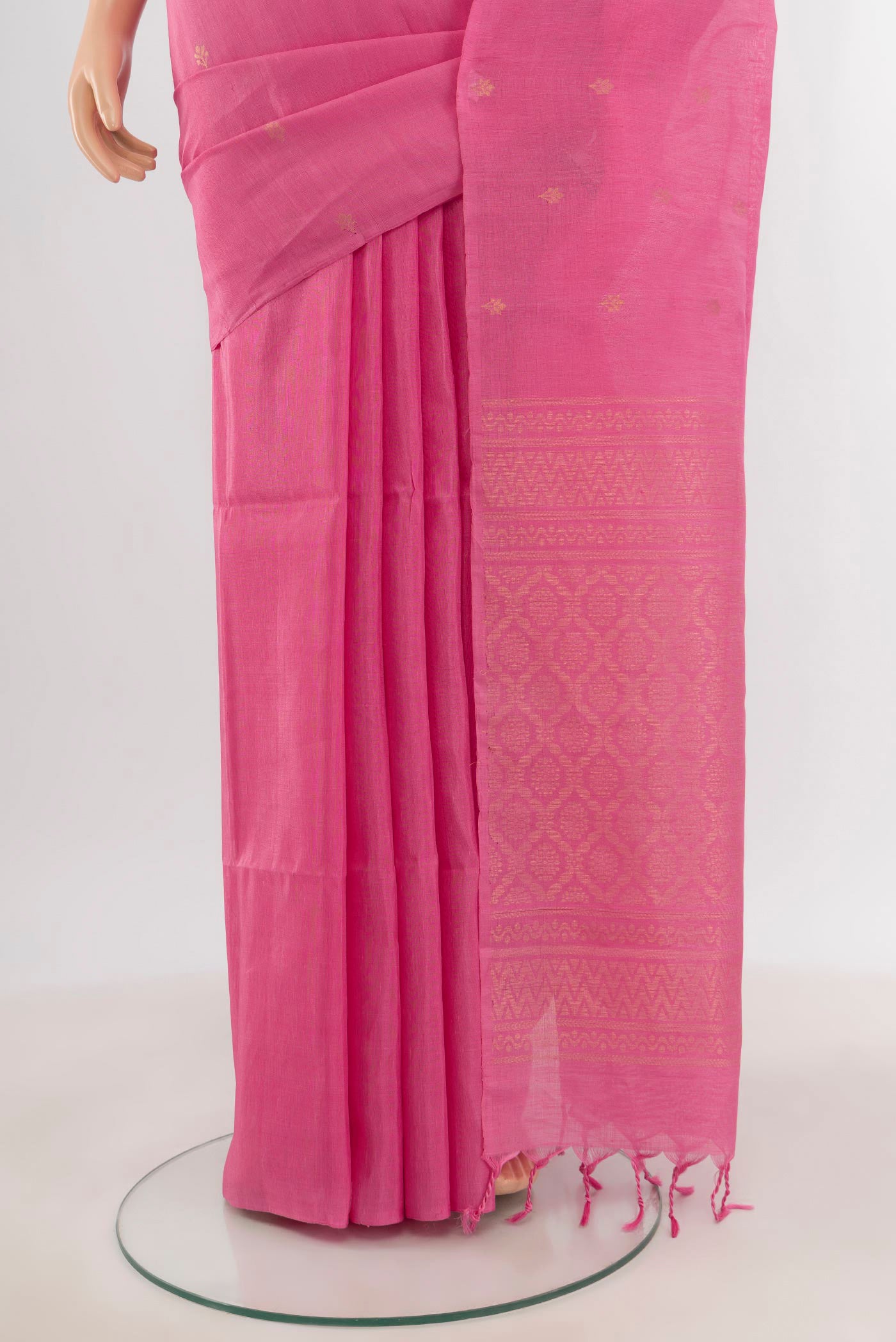 Pleats and pallu of Rose pink Soft Silk Saree with Zari Butta on the body and Without Border. 