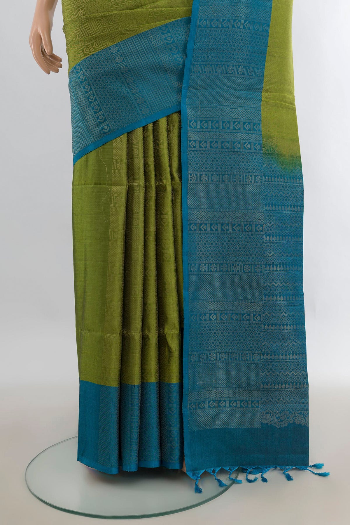 Pleats and pallu of Pure Silk Mehandi Green Soft Saree with Zari Brocade on the body and Plain Border. 