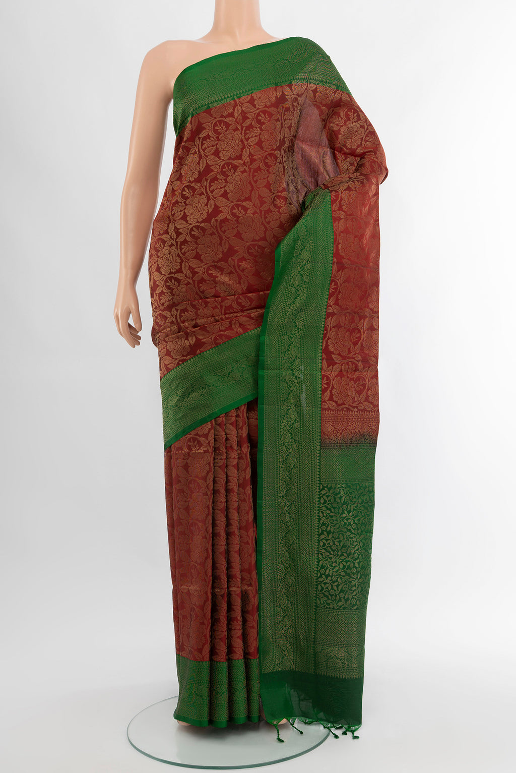 Maroon Soft Silk Saree with Zari Butta on the body and Silk Border.  displayed on a mannequin