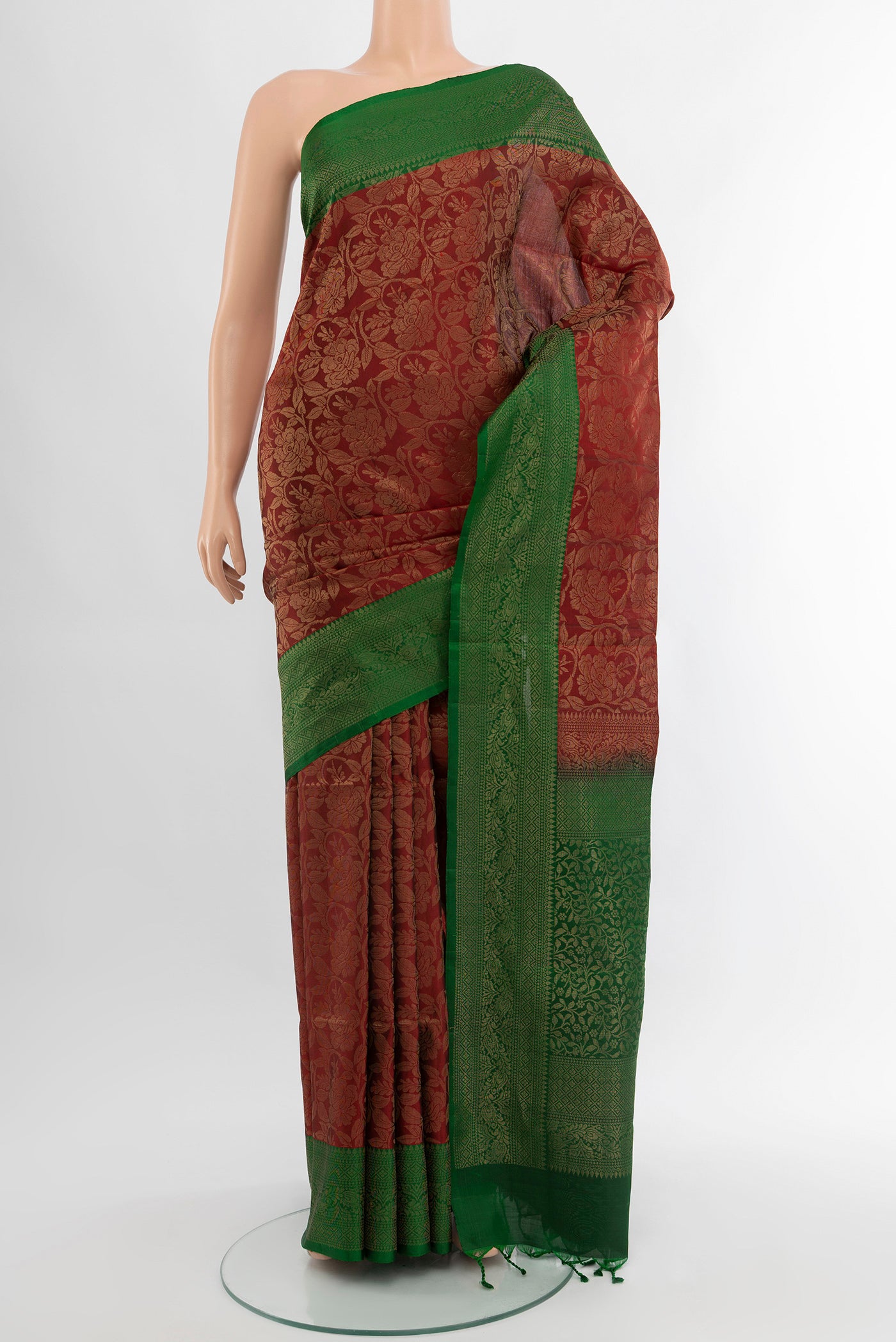 Maroon Soft Silk Saree with Zari Butta on the body and Silk Border.  displayed on a mannequin