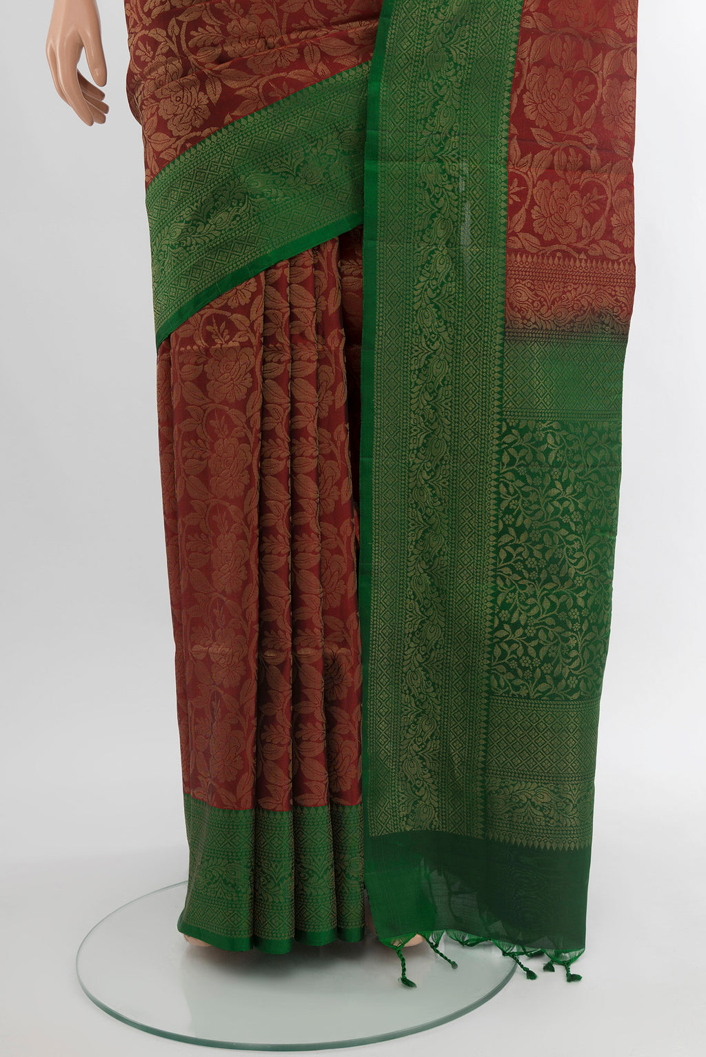 Pleats and pallu of Maroon Soft Silk Saree with Zari Butta on the body and Silk Border. 