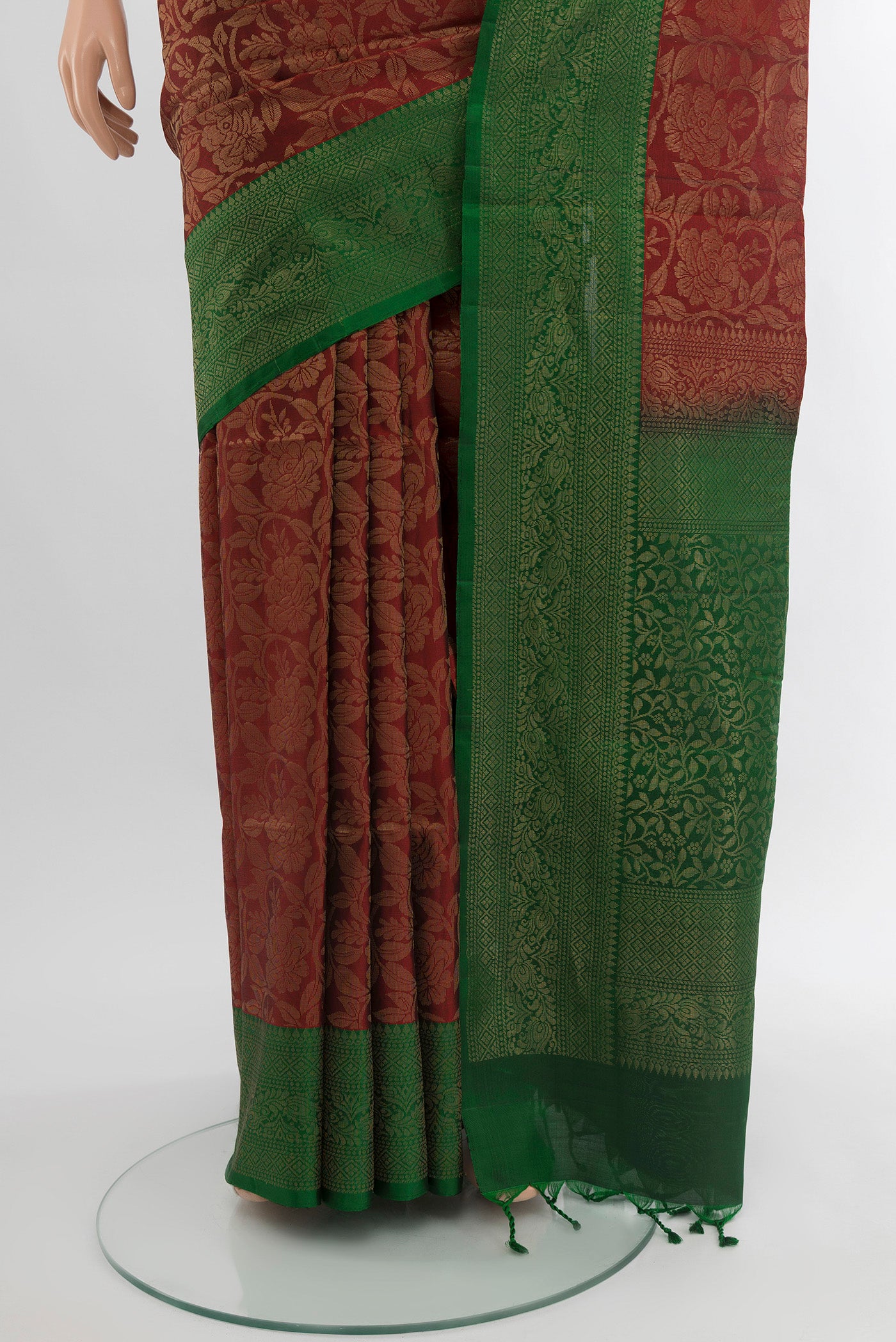 Pleats and pallu of Maroon Soft Silk Saree with Zari Butta on the body and Silk Border. 