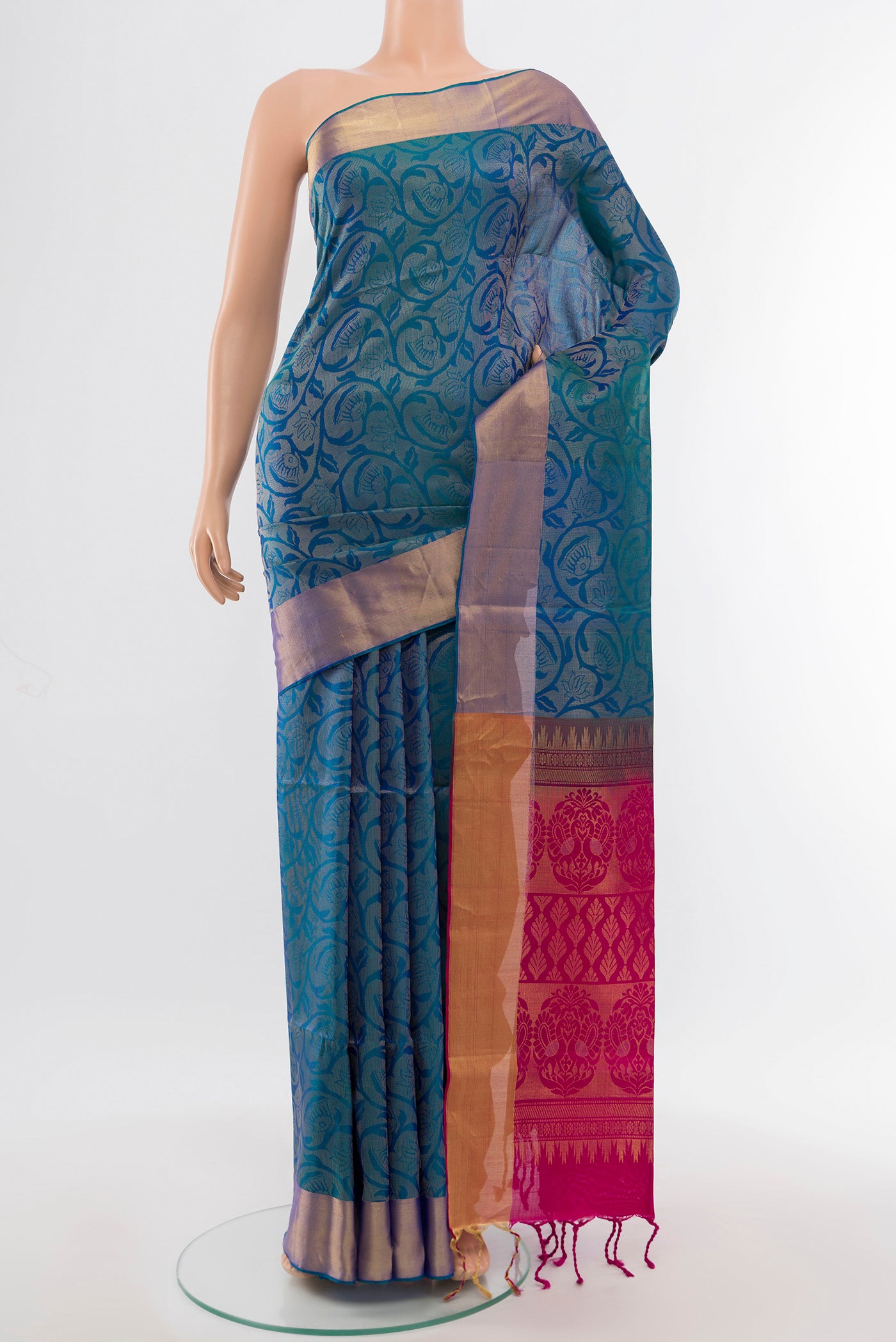 Peacock Blue Soft Silk Saree with Zari Butta on the body and Silk Border.  displayed on a mannequin
