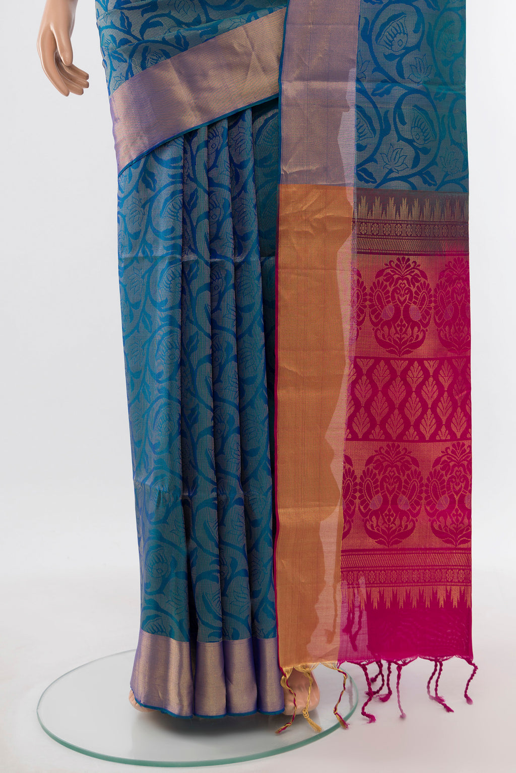 Pleats and pallu of Peacock Blue Soft Silk Saree with Zari Butta on the body and Silk Border. 