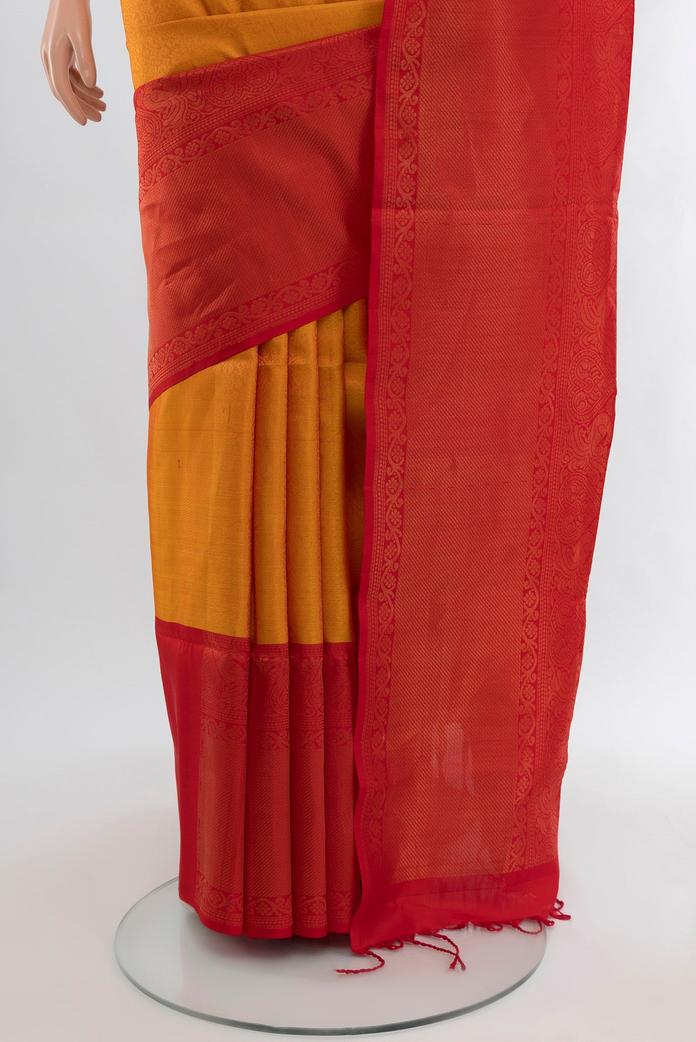 Pleats and pallu of Mustard Soft Silk Saree with Zari Brocade on the body and Zari Border. 
