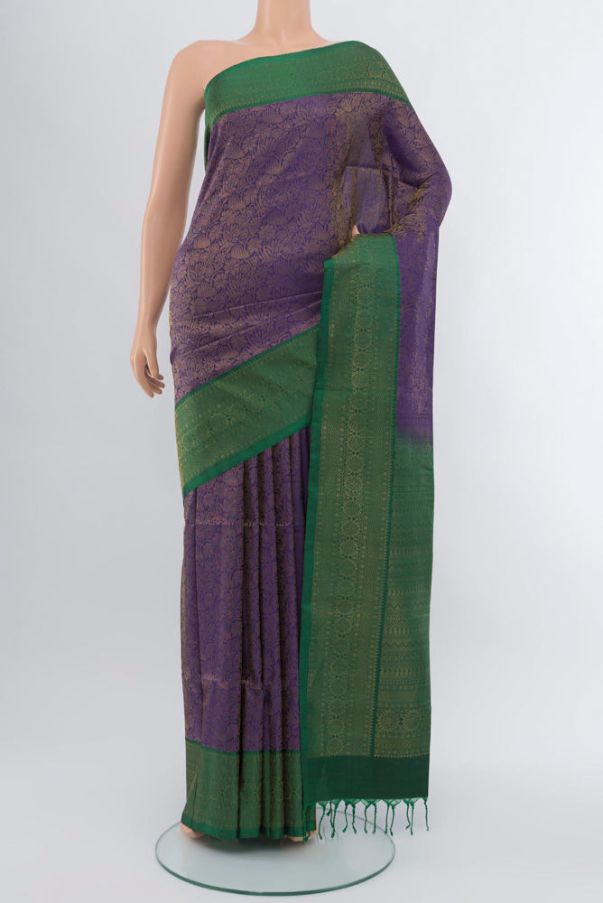 Violet Soft Silk Saree with Zari Butta on the body and Silk Border.  displayed on a mannequin