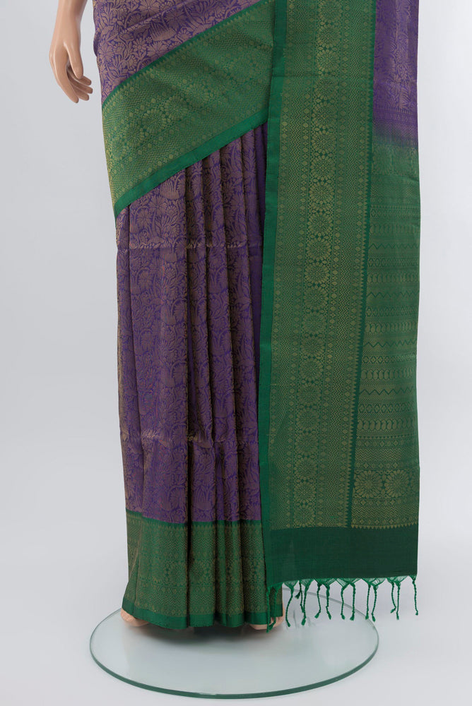 Pleats and pallu of Violet Soft Silk Saree with Zari Butta on the body and Silk Border. 