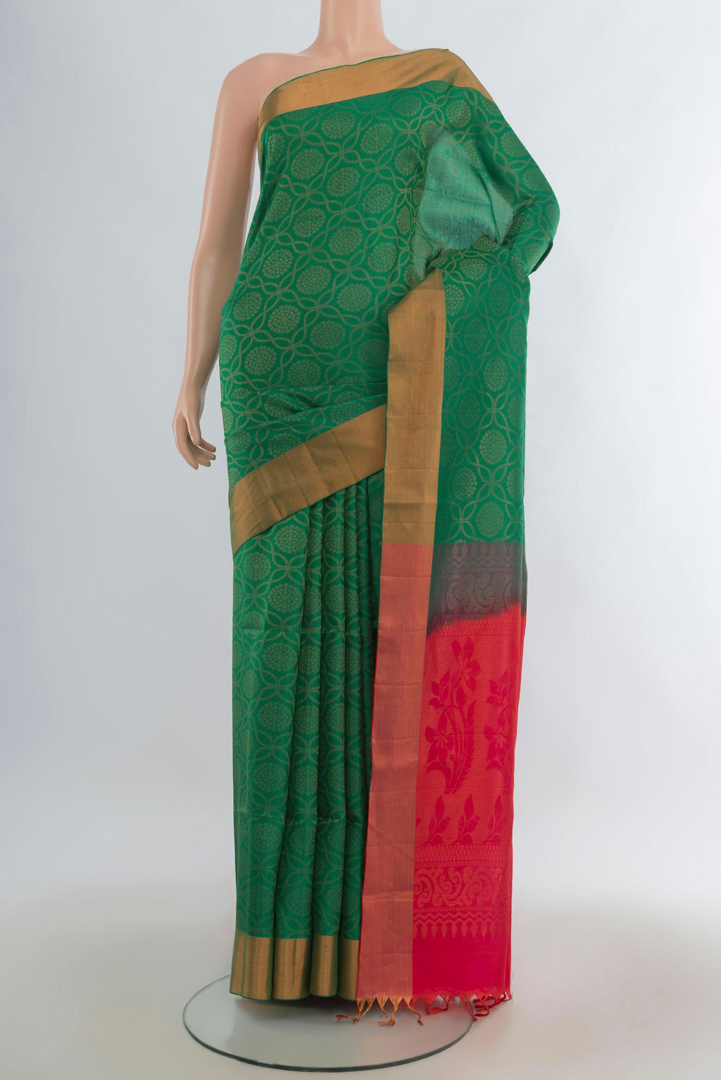 Pure Silk Green Soft Saree with Zari Butta on the body and Zari Border.  displayed on a mannequin