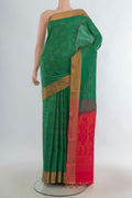 Pure Silk Green Soft Saree with Zari Butta on the body and Zari Border.  displayed on a mannequin