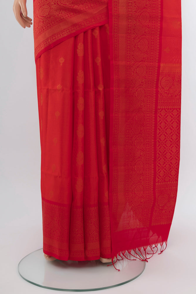 Pleats and pallu of Peach Soft Silk Saree with Zari Butta on the body and Silk Border. 