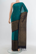 Dark Blue Soft Silk Saree with Zari Butta on the body and Fancy Border.  displayed on a mannequin