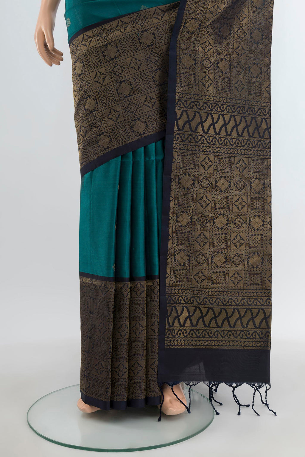 Pleats and pallu of Dark Blue Soft Silk Saree with Zari Butta on the body and Fancy Border. 