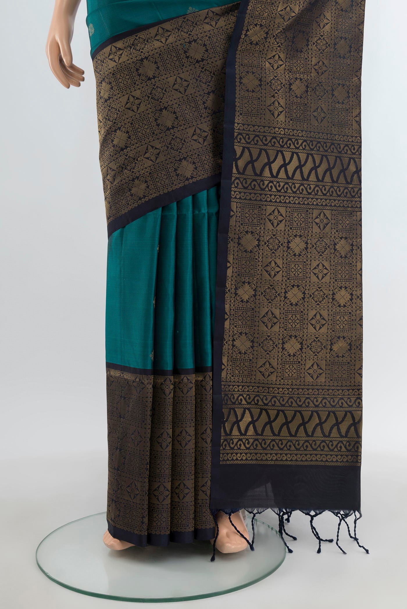 Pleats and pallu of Dark Blue Soft Silk Saree with Zari Butta on the body and Fancy Border. 