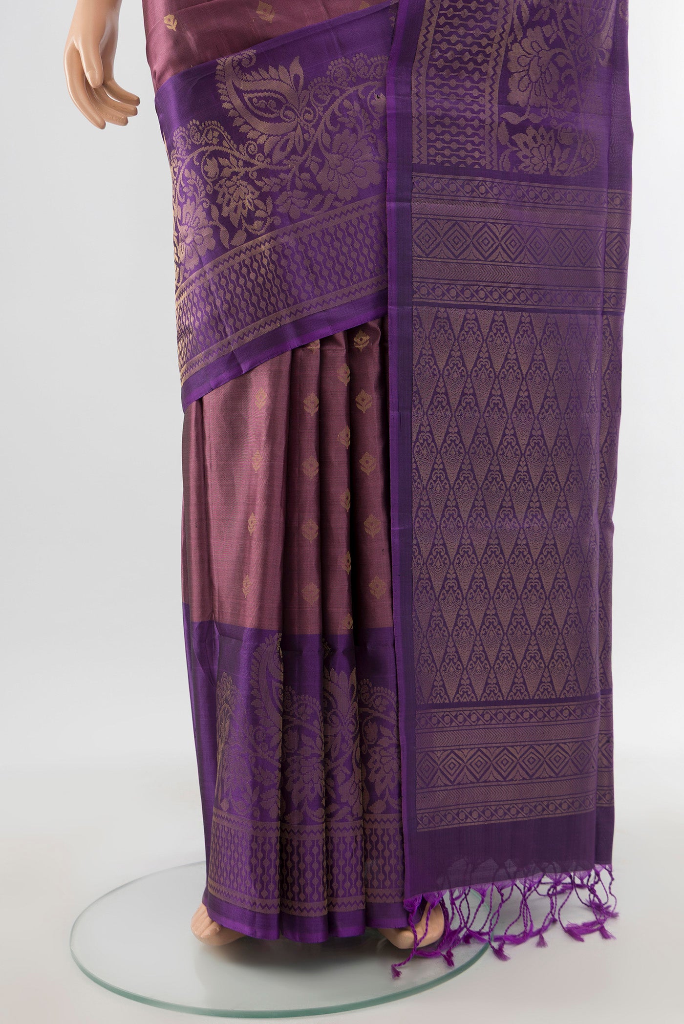 Pleats and pallu of Bronze Soft Silk Saree with Zari Butta on the body and Silk Border. 