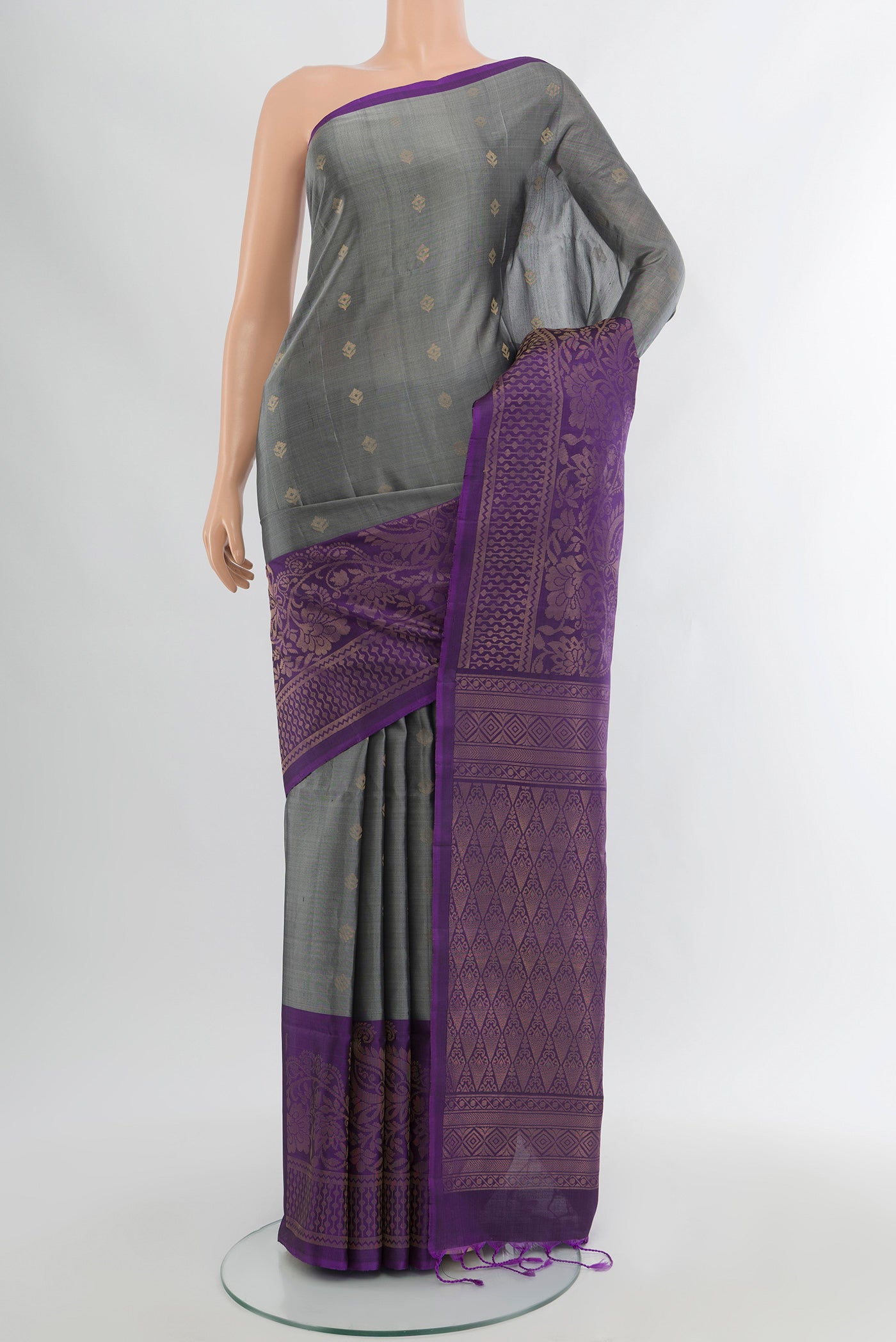 Davys Grey Soft Silk Saree with Zari Butta on the body and Silk Border.  displayed on a mannequin