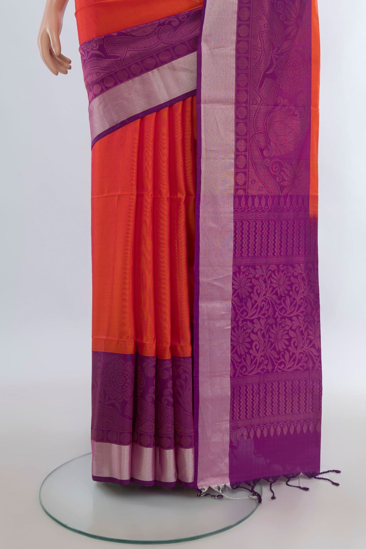 Pleats and pallu of Pure Silk Brick Orange Soft Saree with Zari Butta on the body and Zari Border. 