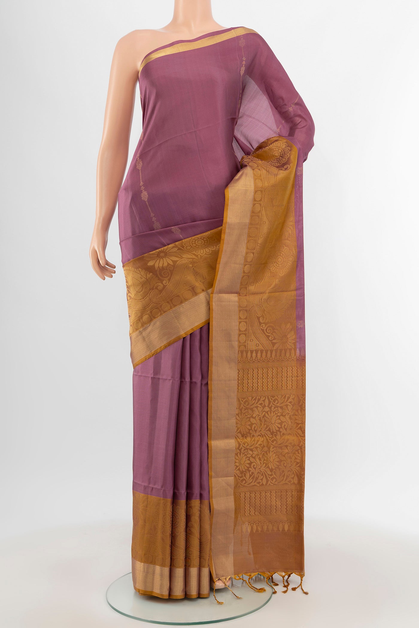 Mauve Soft Silk Saree with Zari Butta on the body and Zari Border.  displayed on a mannequin