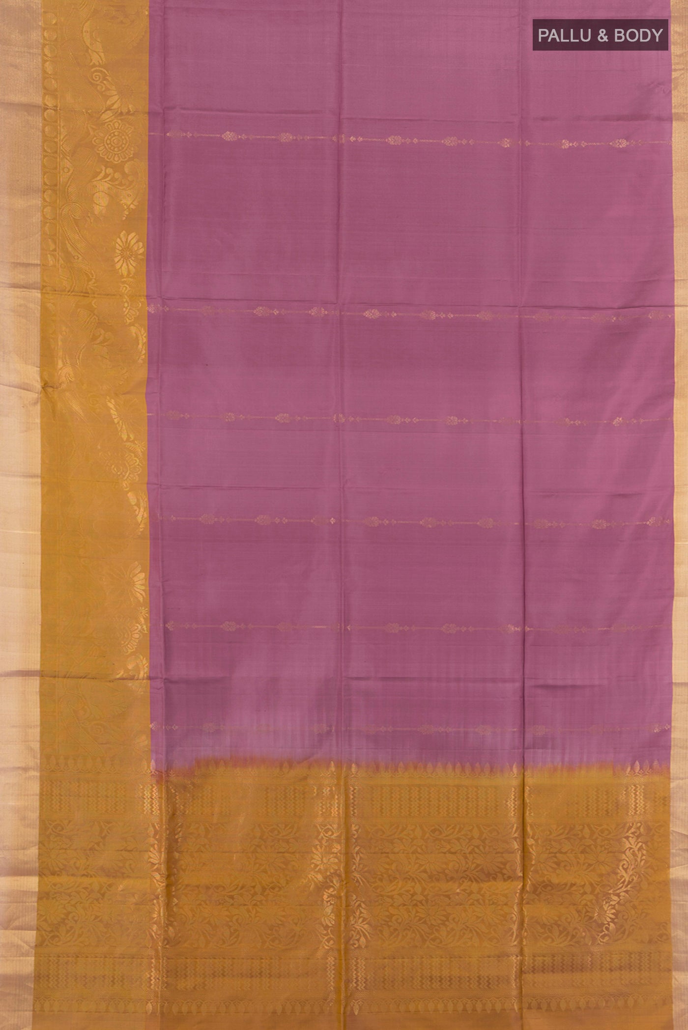 Flat view of Mauve Soft Silk Saree with Zari Butta on the body and Zari Border. 