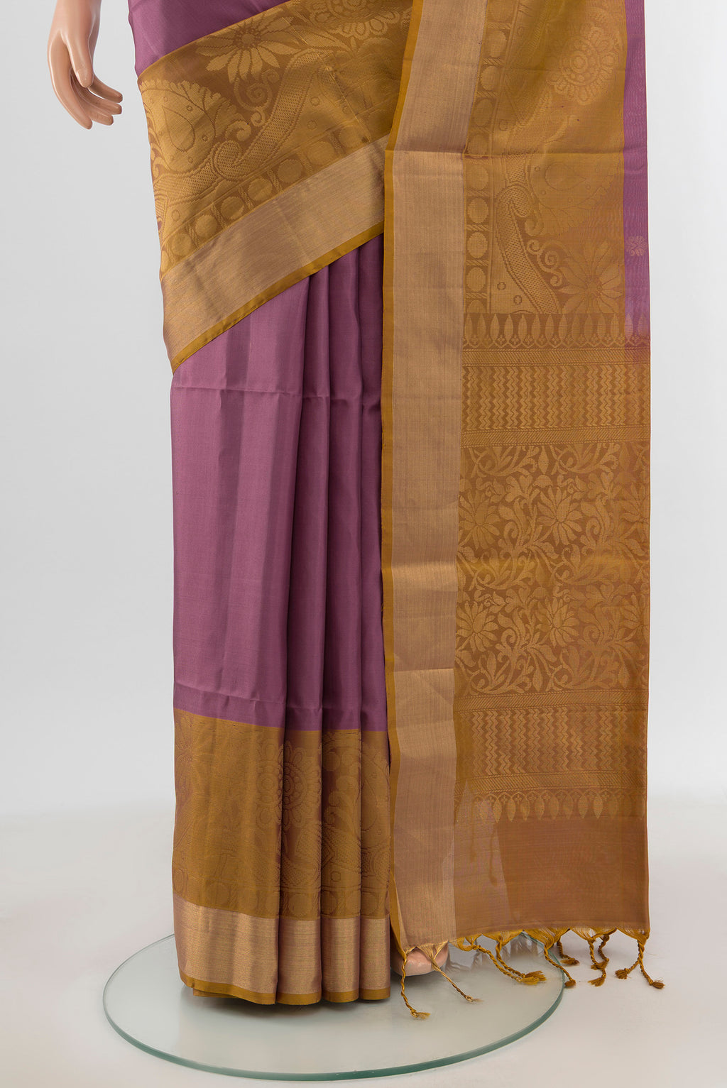 Pleats and pallu of Mauve Soft Silk Saree with Zari Butta on the body and Zari Border. 