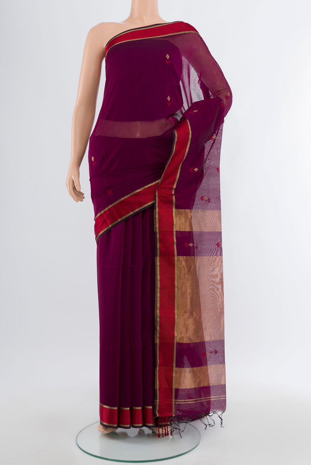 Purple Maheshwari Silk Cotton Saree with Plain Body and Silk Border.  displayed on a mannequin