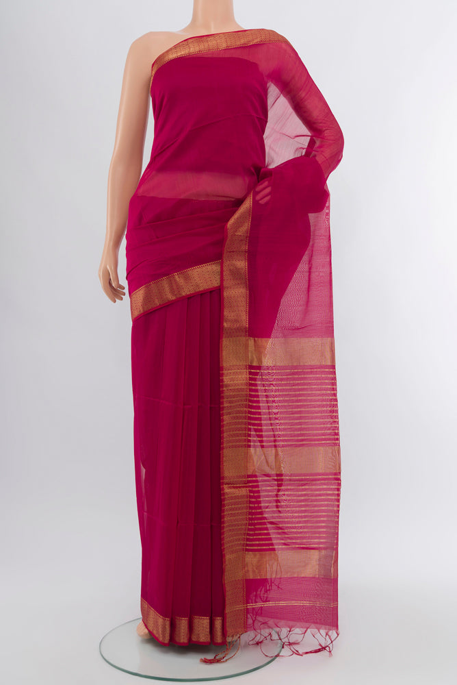 Dark Pink Maheshwari Silk Cotton Saree with Zari Butta on the body and Silk Border.  displayed on a mannequin