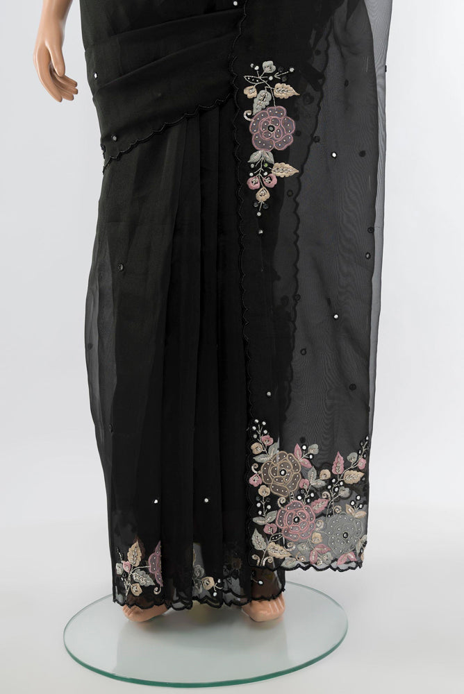 Pleats and pallu of Black Art Silk Saree with Embroidery on the body and Silk Border. 