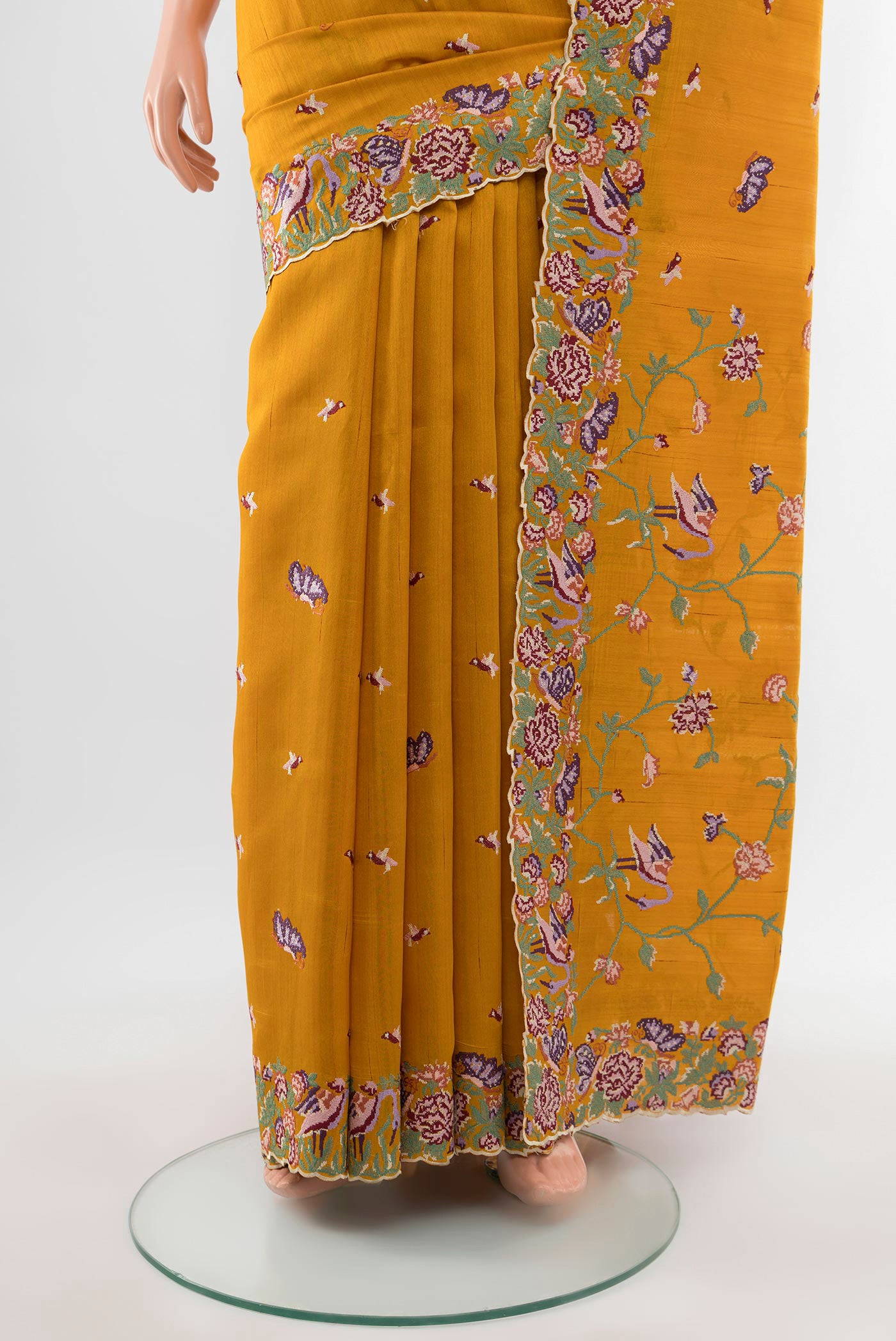 Pleats and pallu of Mustard Art Silk Saree with Embroidery on the body and Silk Border. 