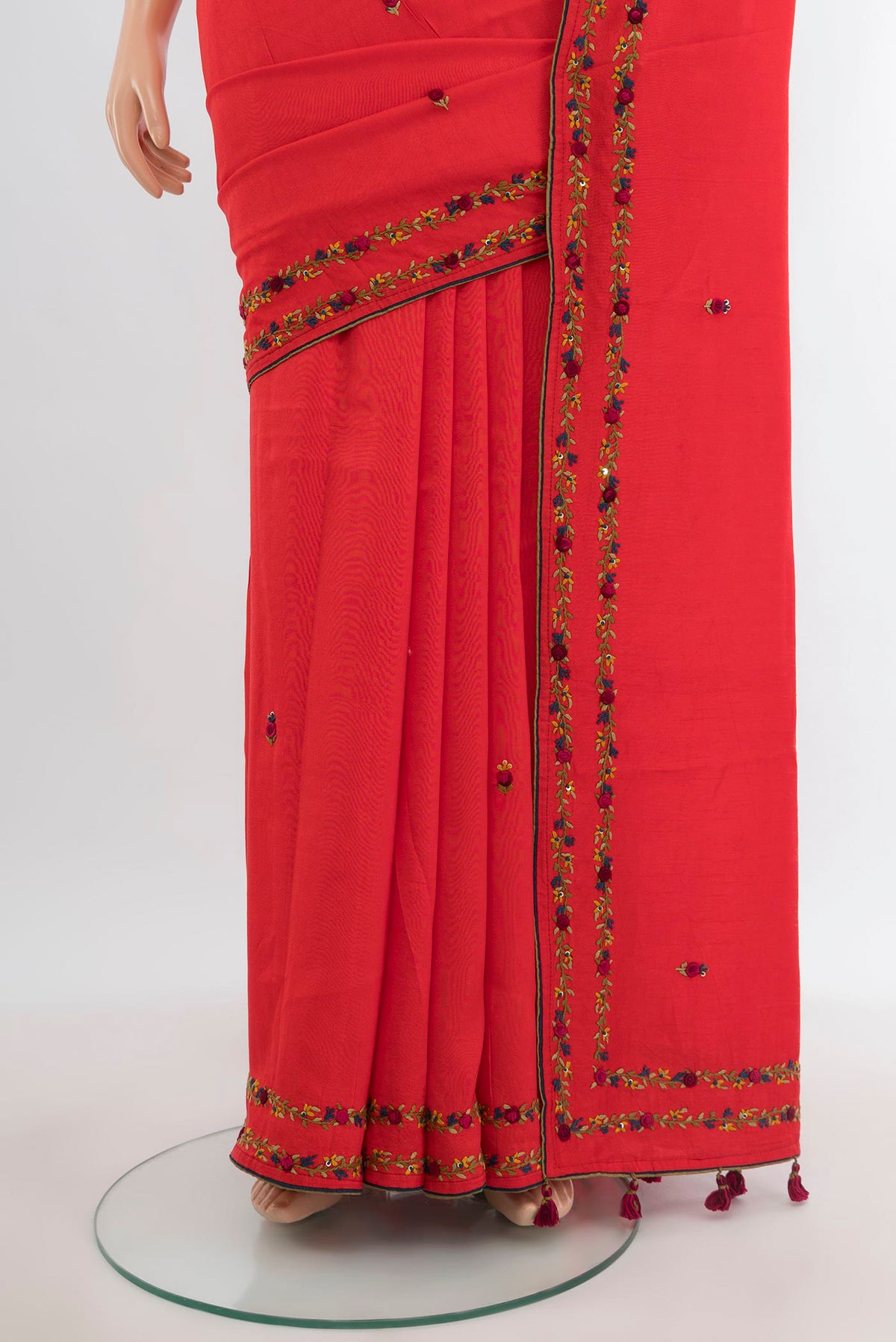 Pleats and pallu of Orange Blended Art Silk Saree with Embroidery on the body and Embroidery Border. 