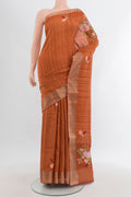 Rust Blended Art Silk Saree with Embroidery on the body and Zari Border.  displayed on a mannequin
