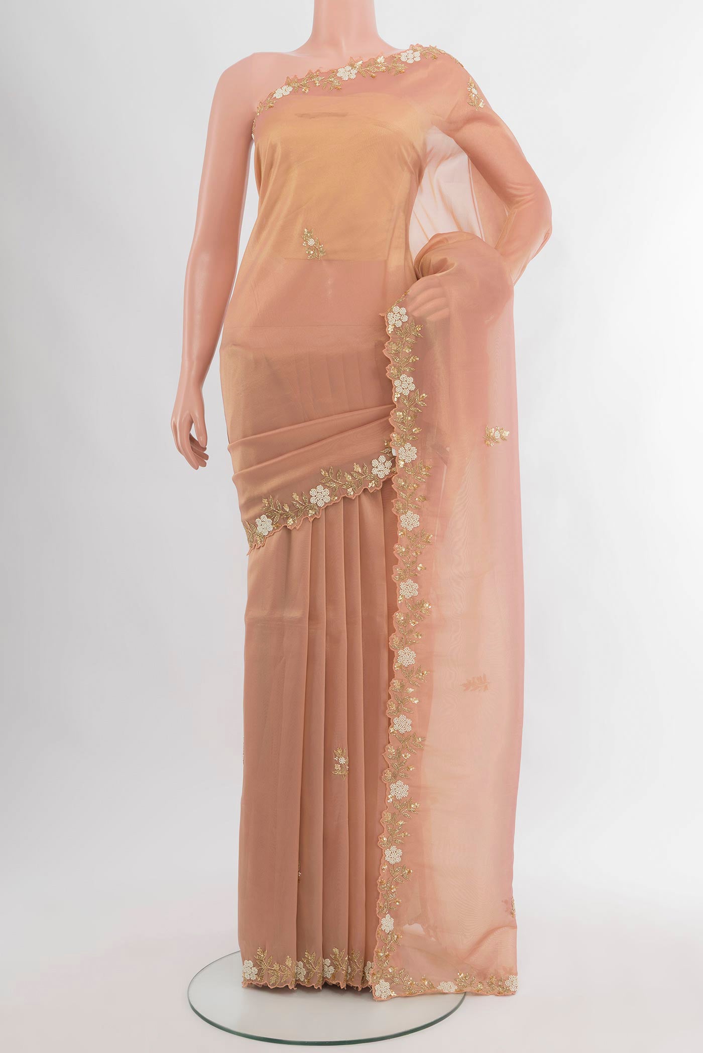 Peach Blended Tissue Silk Saree with Embroidery on the body and Embroidery Border.  displayed on a mannequin
