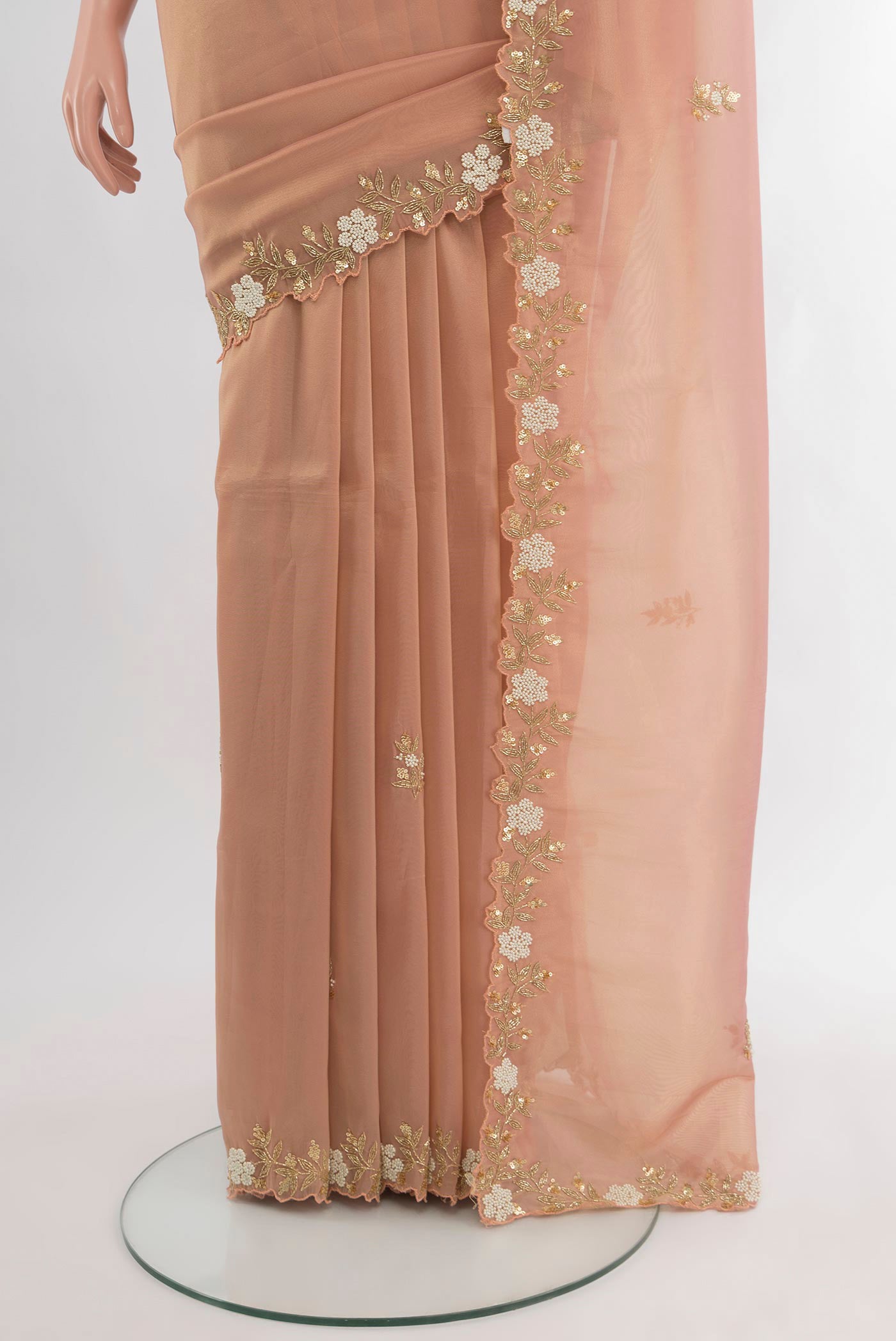 Pleats and pallu of Peach Blended Tissue Silk Saree with Embroidery on the body and Embroidery Border. 