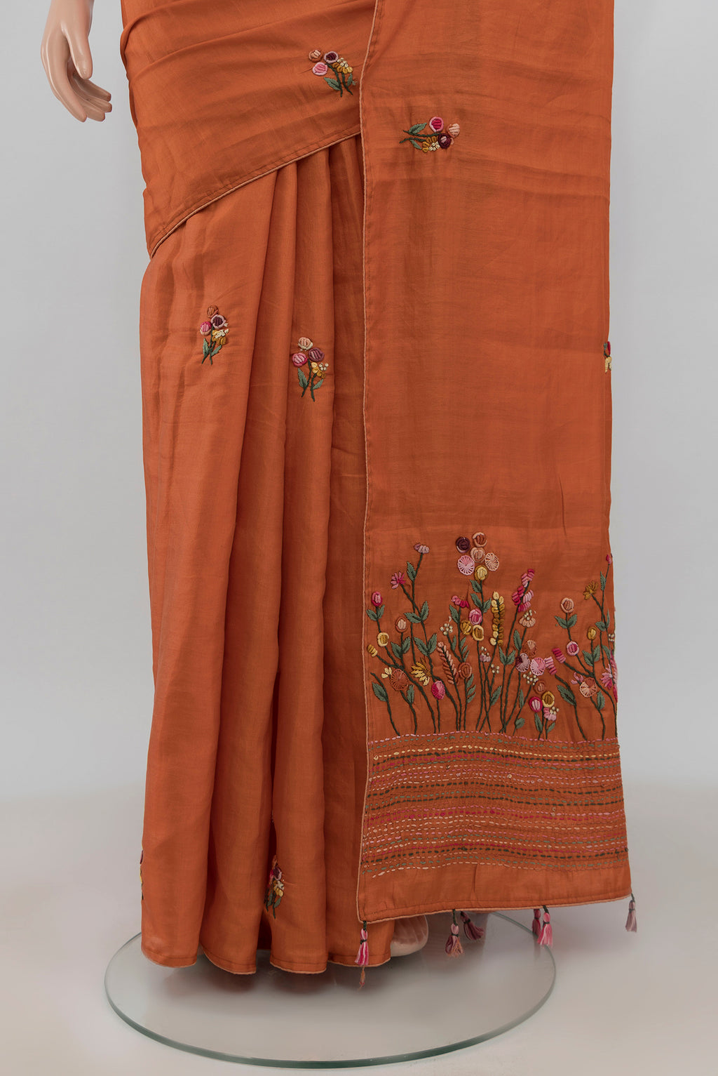 Pleats and pallu of Orange Blended Art Silk Saree with Embroidery on the body and Embroidery Border. 