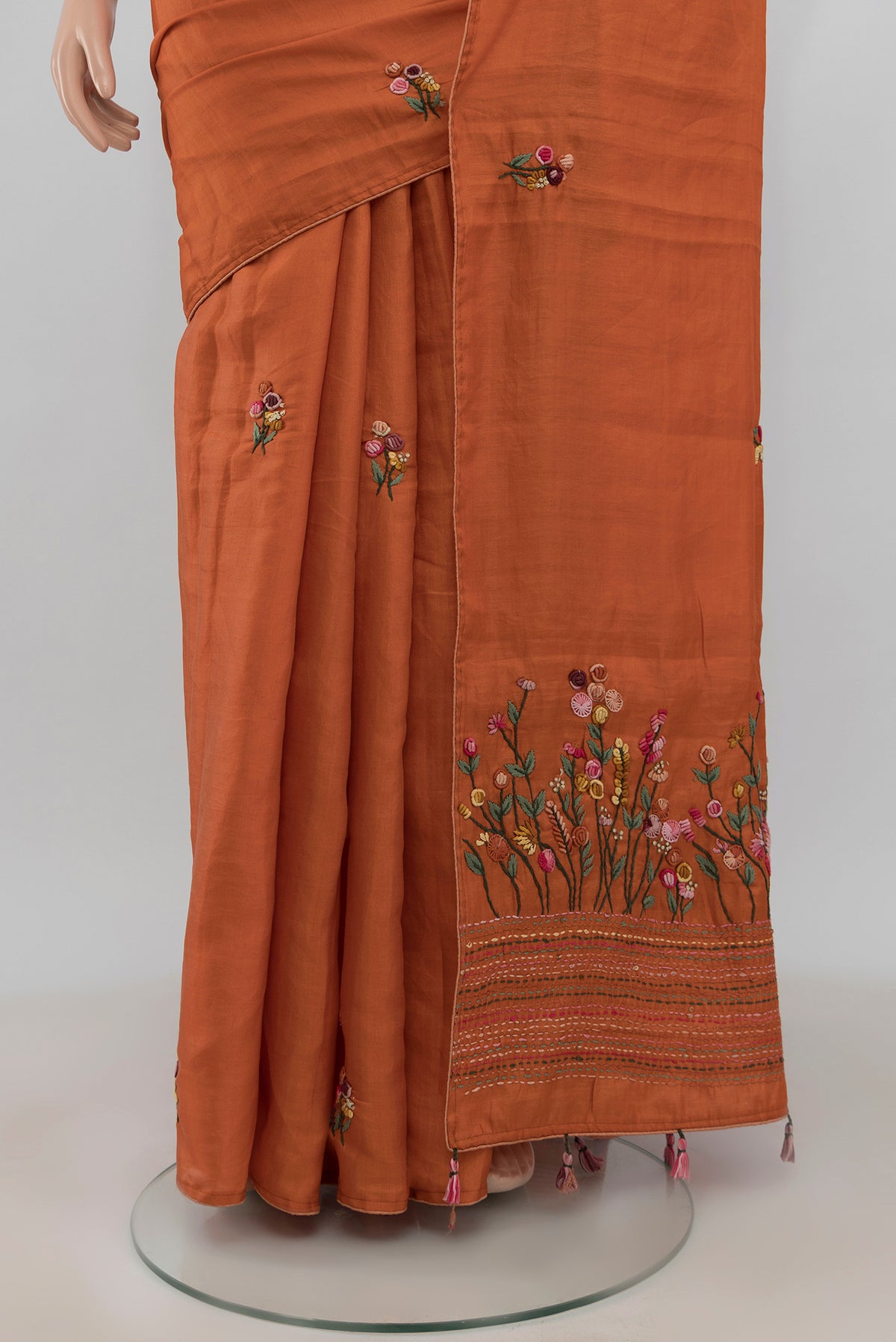 Pleats and pallu of Orange Blended Art Silk Saree with Embroidery on the body and Embroidery Border. 