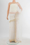 Cream Embroidery Net Saree with Embroidery on the body and Silk Border.  displayed on a mannequin