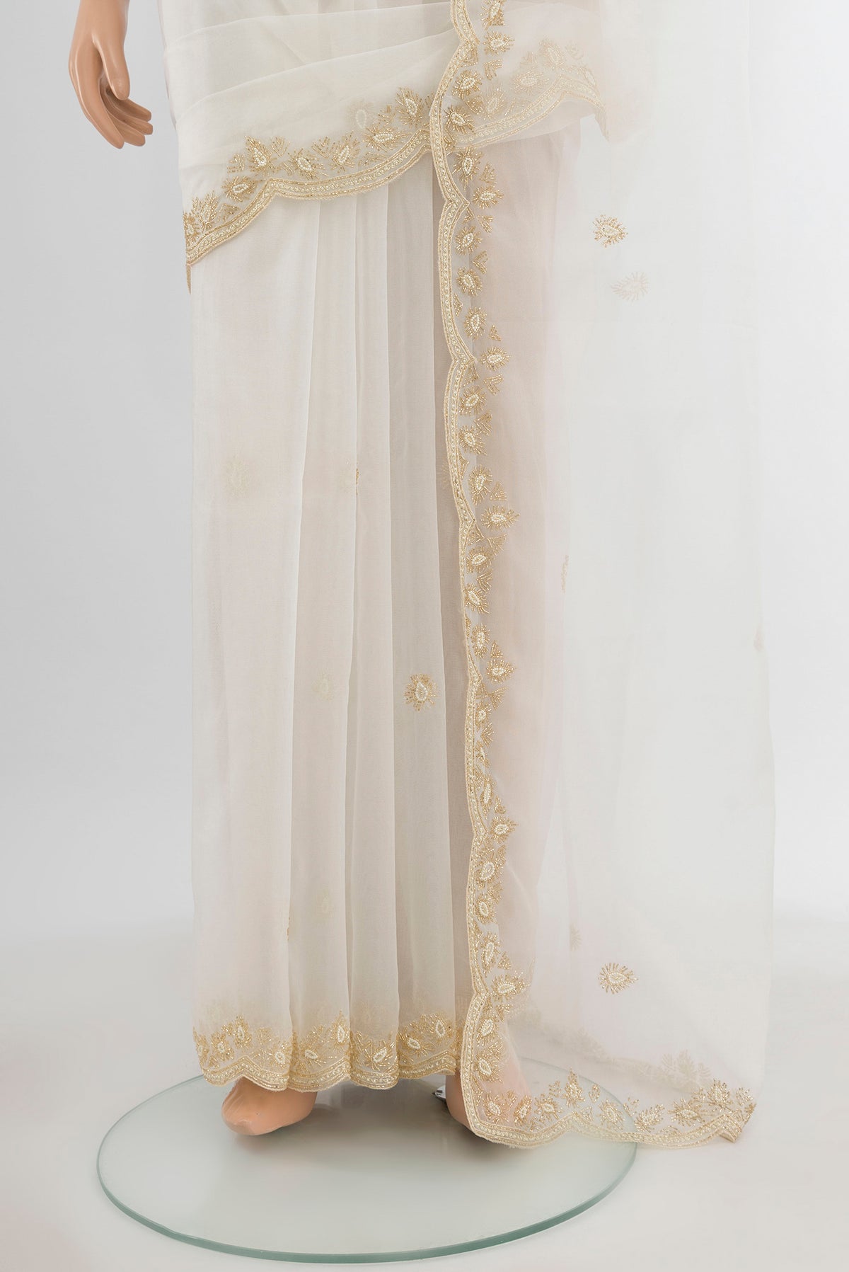 Pleats and pallu of Cream Embroidery Net Saree with Embroidery on the body and Silk Border. 