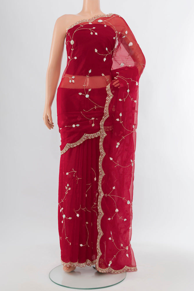 Red Art Silk Saree with Embroidery on the body and Silk Border.  displayed on a mannequin