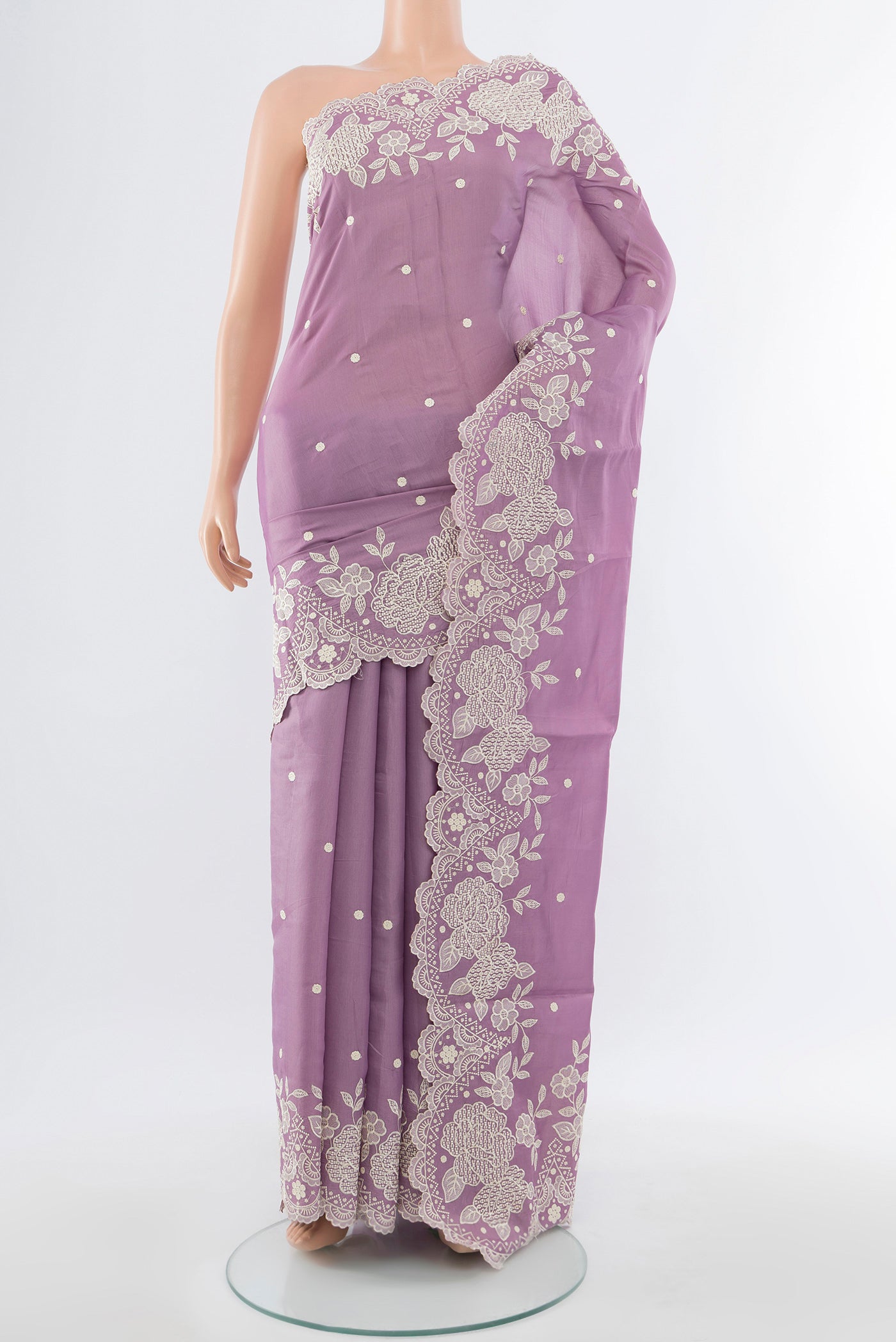 Lavender Art Silk Saree with Embroidery on the body and Silk Border.  displayed on a mannequin