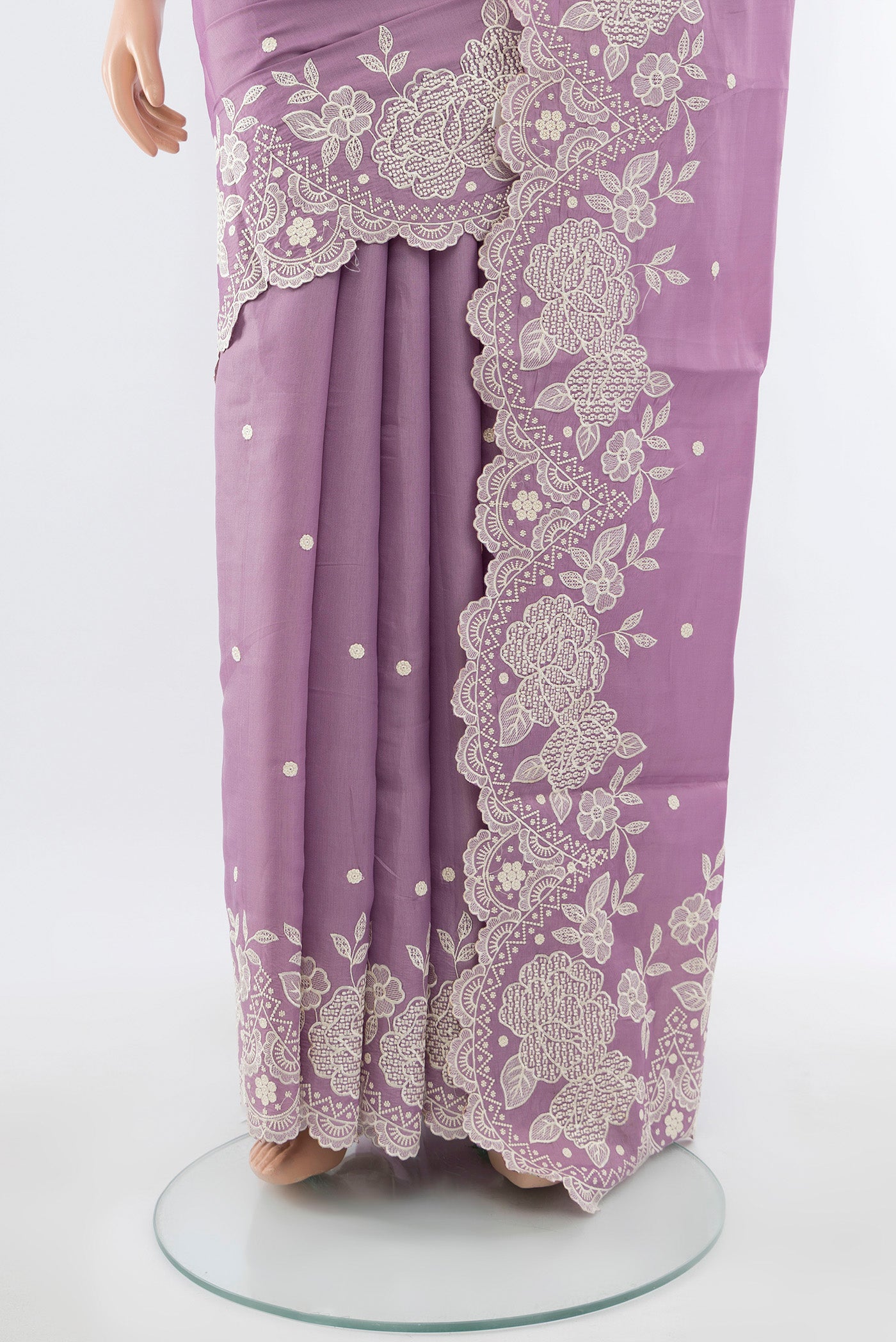 Pleats and pallu of Lavender Art Silk Saree with Embroidery on the body and Silk Border. 