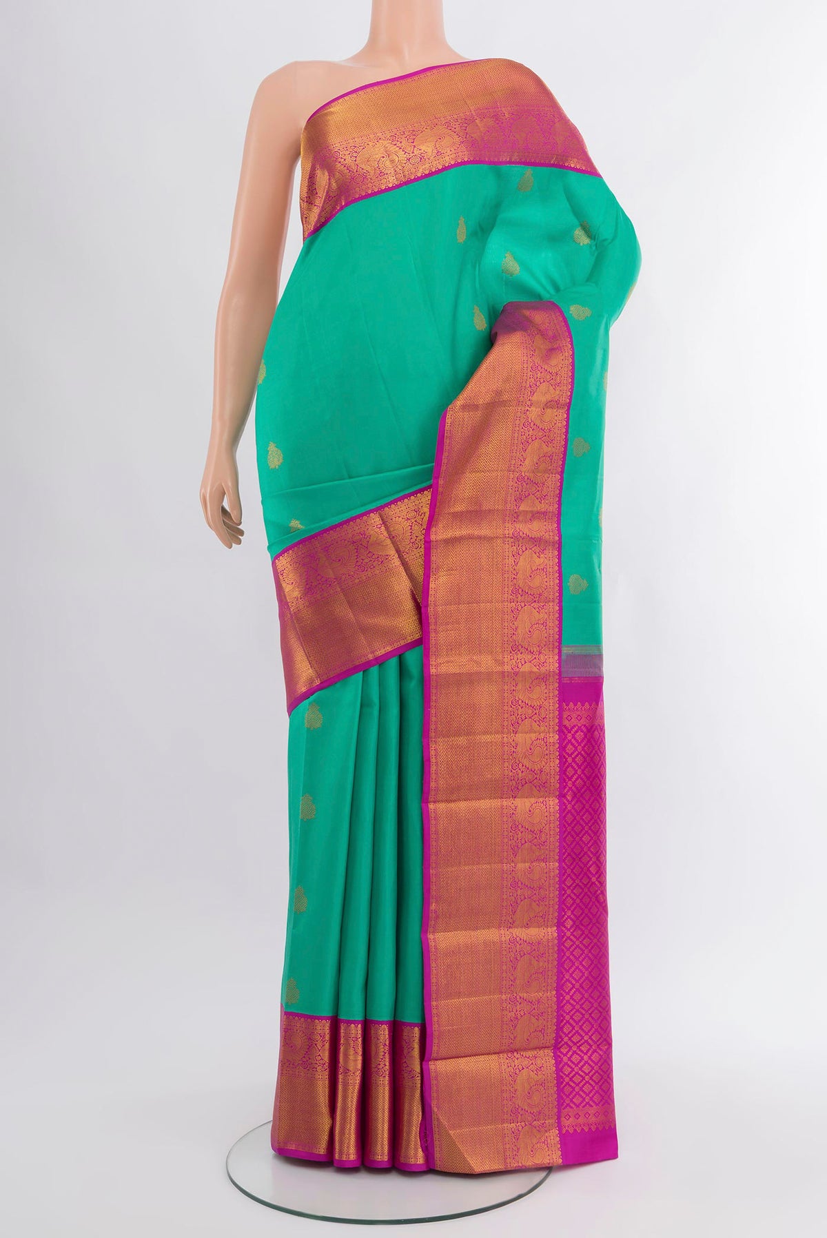 Turquoise Kanjivaram Silk Saree with Zari Butta on the body and Zari Border.  displayed on a mannequin